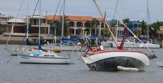 Mooloolaba blocky houses - be careful where you anchor - this New Zealand boat had to wait twelve hours before gouging the sand to get off the sand bank © BW Media